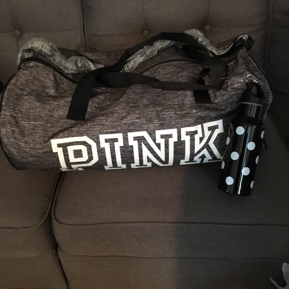 Large pink duffle bag with water bottle